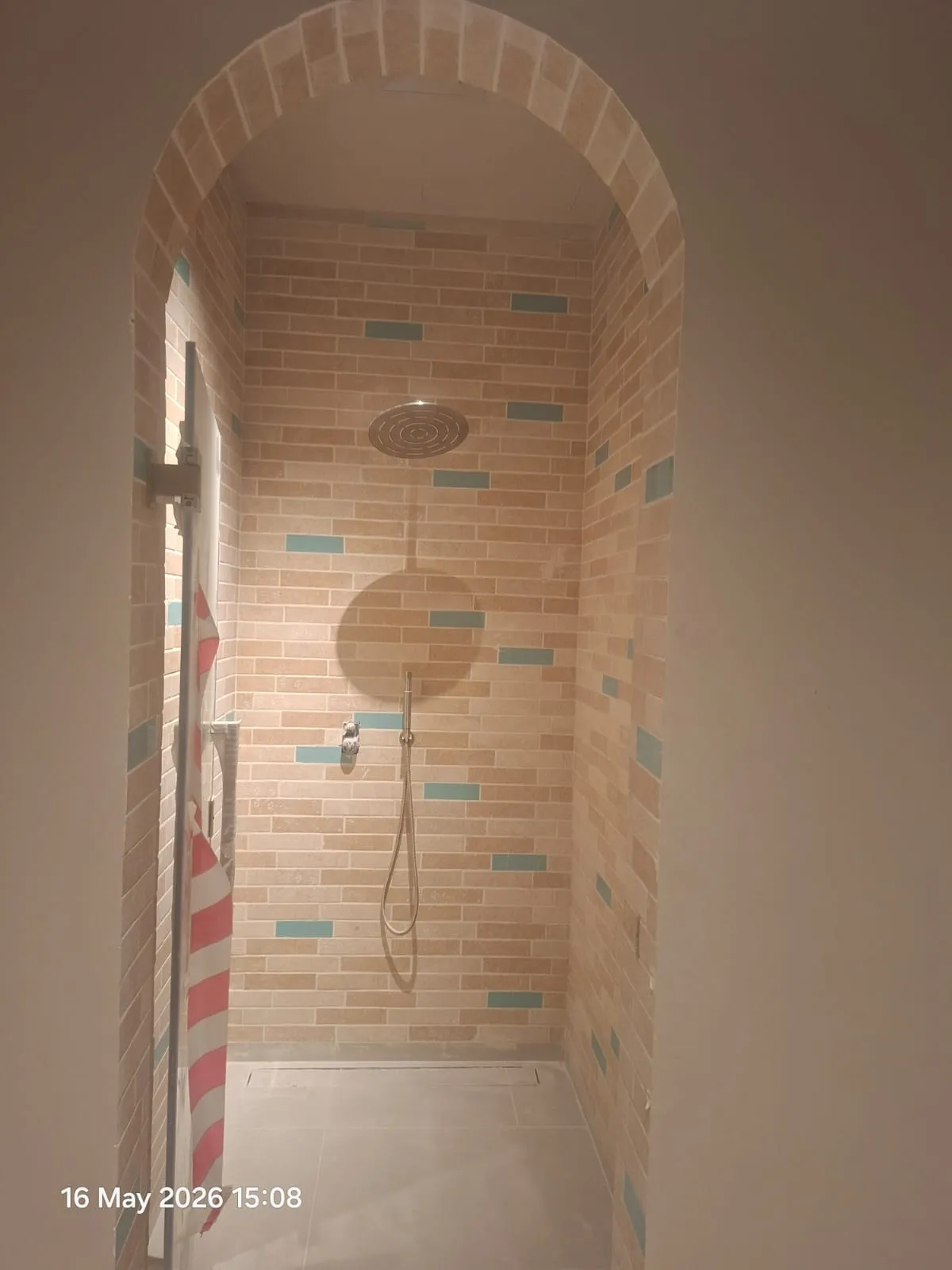 Arched Shower with Rain Shower Tiling – Tiling & Tile Fixing in Dubai by Pasupati Technical Services