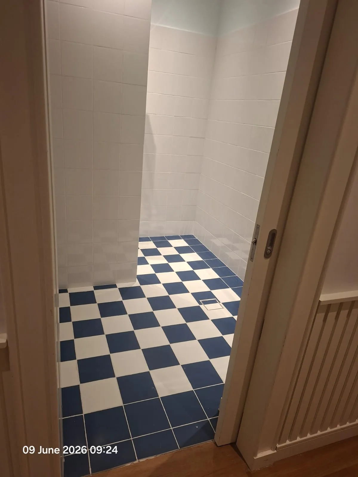 Blue and White Checkerboard Bathroom Floor – Tiling & Tile Fixing in Dubai by Pasupati Technical Services