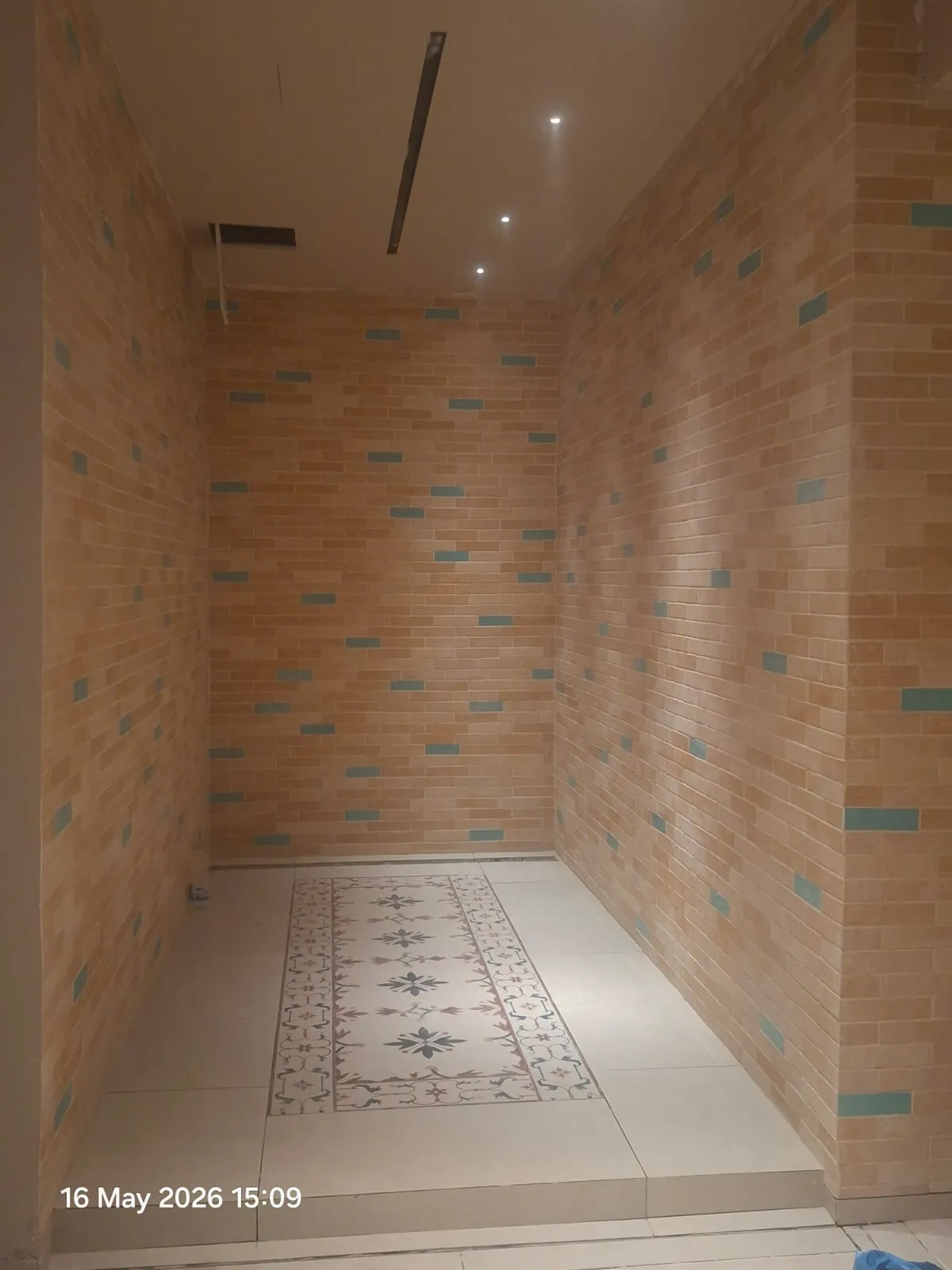 Brick Effect Shower with Patterned Floor – Tiling & Tile Fixing in Dubai by Pasupati Technical Services