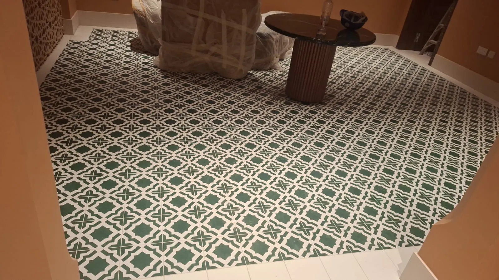 Green Patterned Floor Tiles Lounge – Tiling & Tile Fixing in Dubai by Pasupati Technical Services