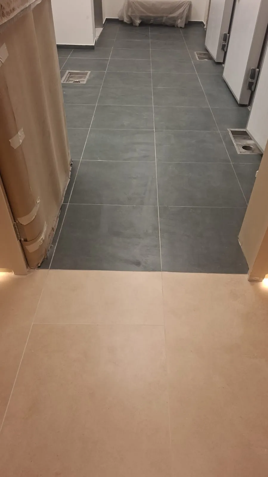 Grey Porcelain Corridor Floor Tiles – Tiling & Tile Fixing in Dubai by Pasupati Technical Services