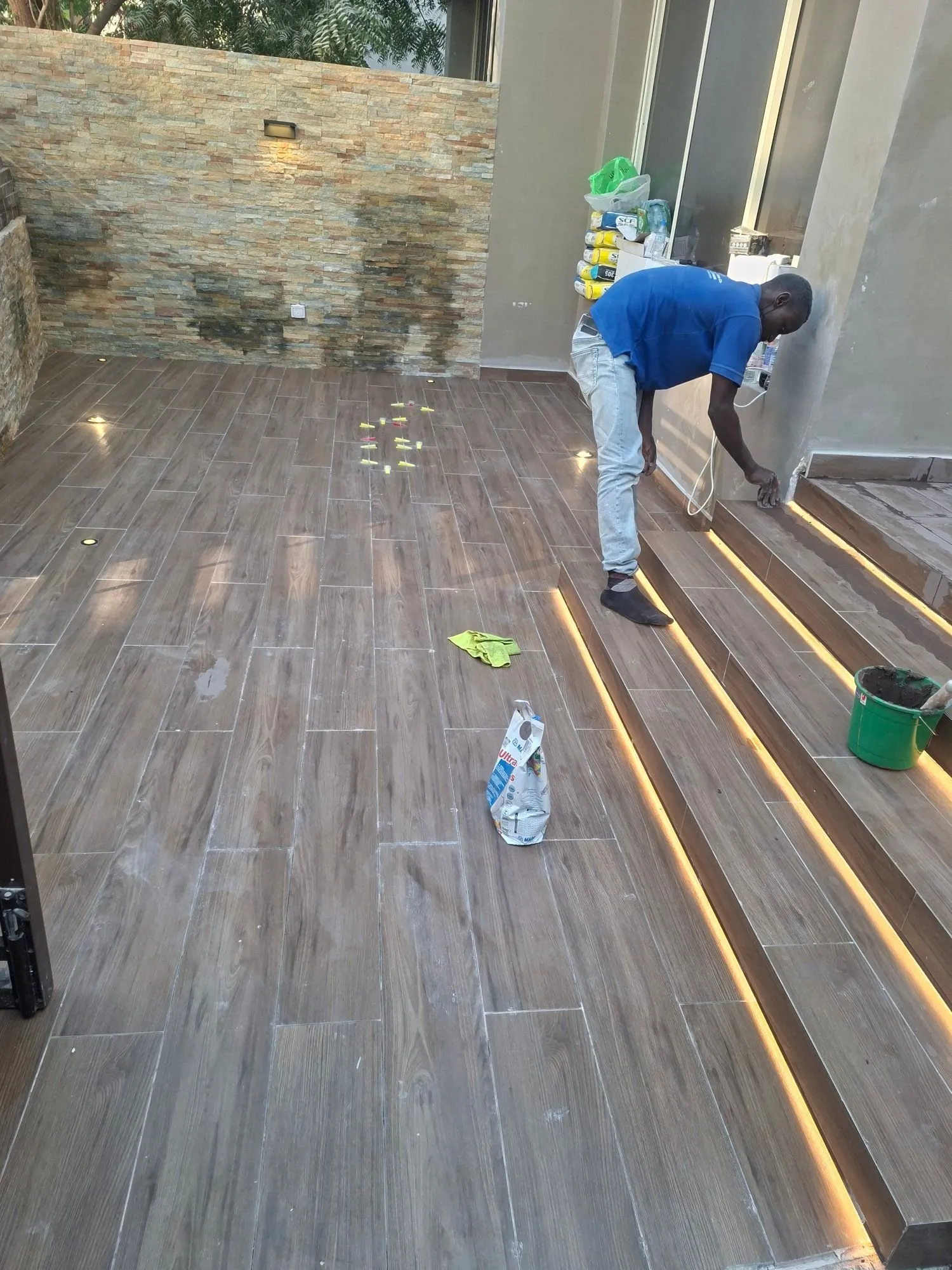 Wood Effect Staircase Tiles with LED – Tiling & Tile Fixing in Dubai by Pasupati Technical Services